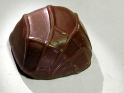 Photo of outside of See&rsquo;s&reg; Milk Chocolate Caramel (?) Truffle